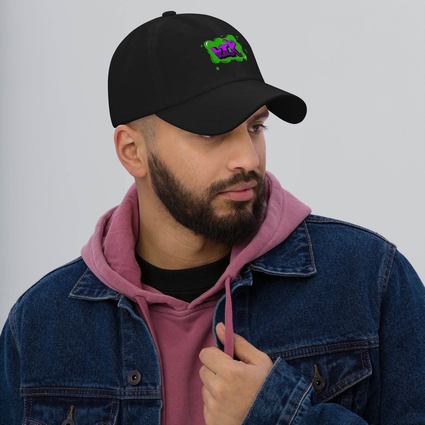 Y2K streetwear style purple and green graffiti baseball cap featuring VIK urban name tag artwork by London illustrator VKM Illustrations.