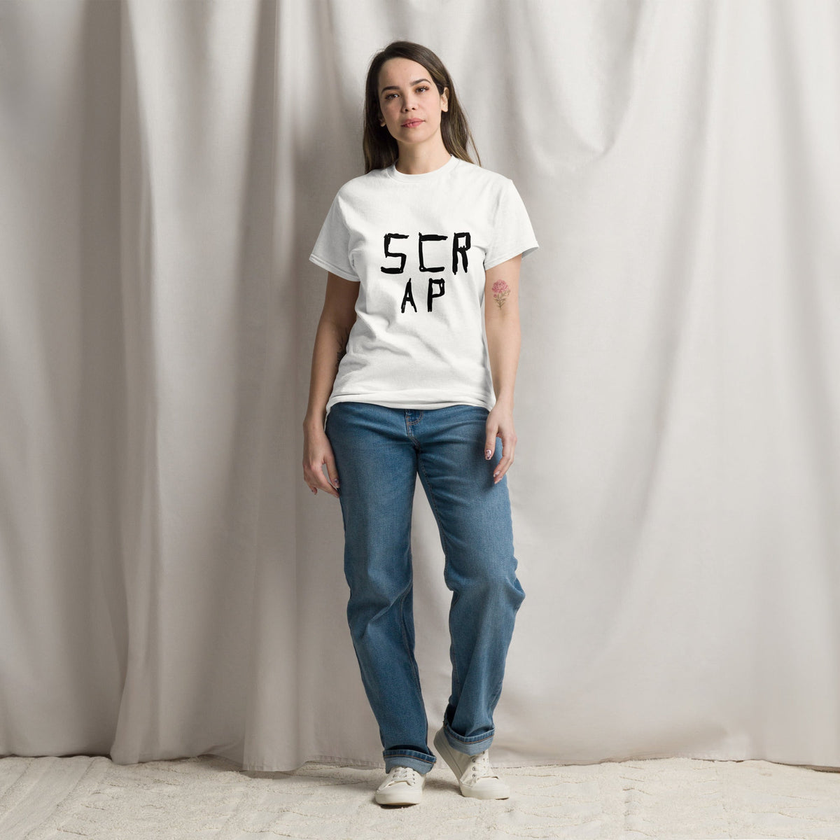 “Minimalist white graphic novel t-shirt featuring the black ink text phrase 'Scrap' by London comic artist VKM Illustration.”