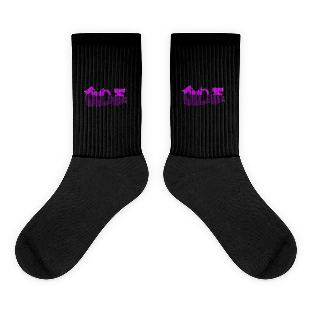 VKM Illustrations june graffiti art print on a black crew sock with a cushioned sole.