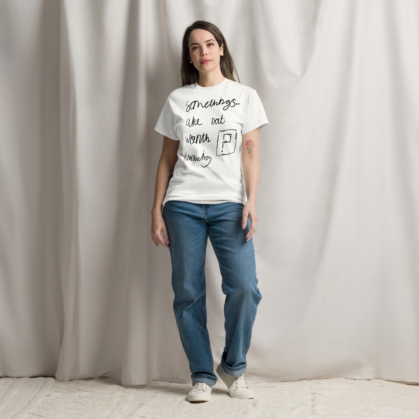 Minimalist white slogan t-shirt featuring the black text phrase 'Some things are not worth knowing' by London artist VKM Illustrations.