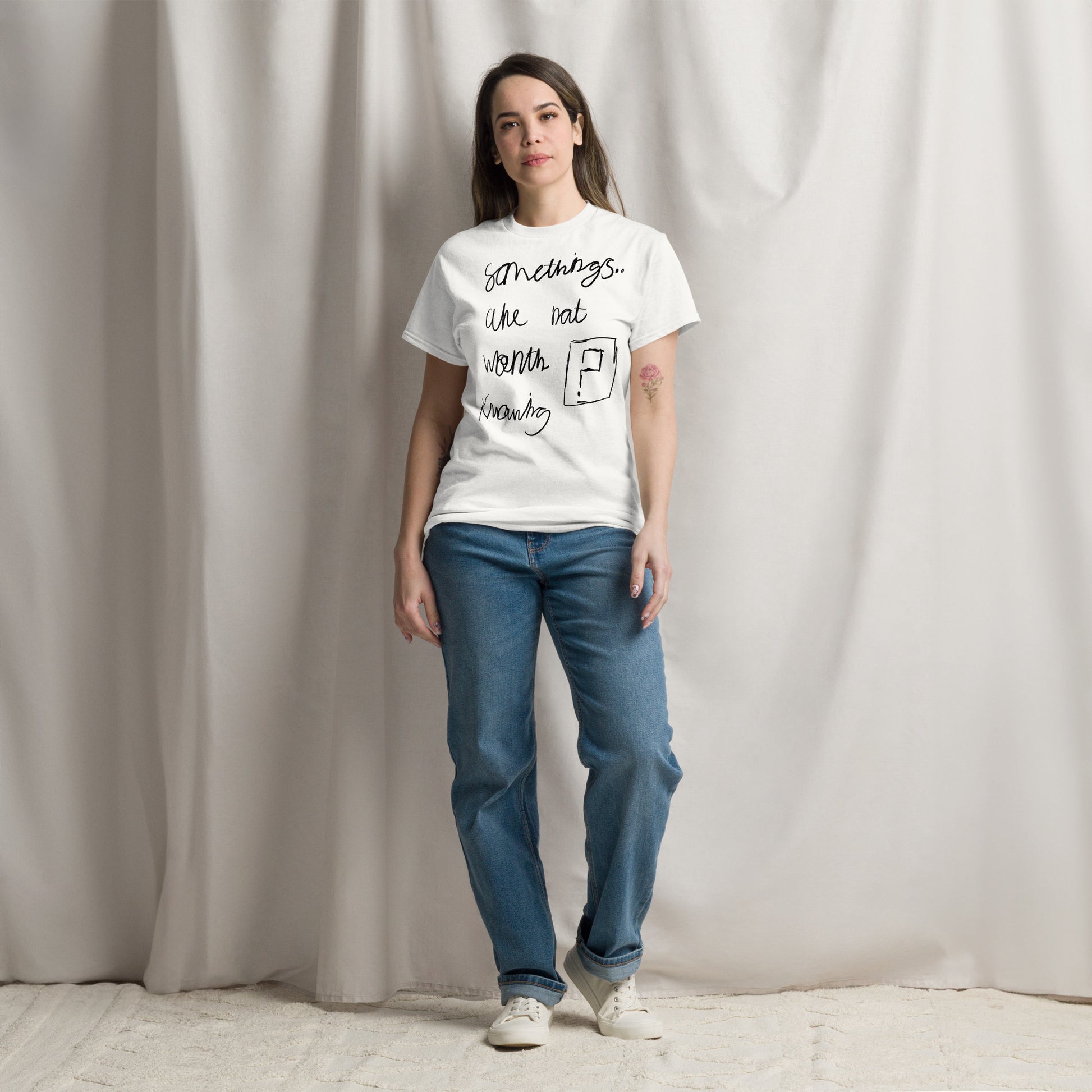 Minimalist white slogan t-shirt featuring the black text phrase 'Some things are not worth knowing' by London artist VKM Illustrations.