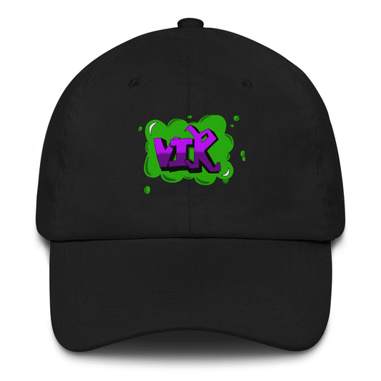 Black classic dad hat featuring vibrant purple "VIK" graffiti lettering framed by a green slime graphic on the front panel.